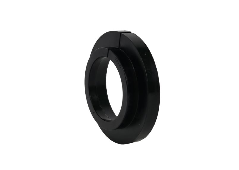 SPRING - PAD/TRIM PACKER BUSHING - REV246.0004