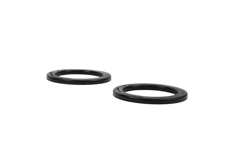 SPRING - PAD/TRIM PACKER BUSHING - REV246.0010